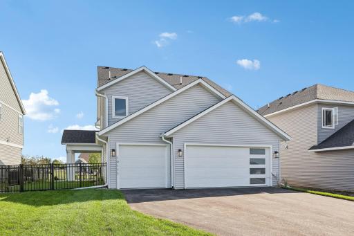 Fenced side yard. Photos are from similar home; colors, options and features will vary.