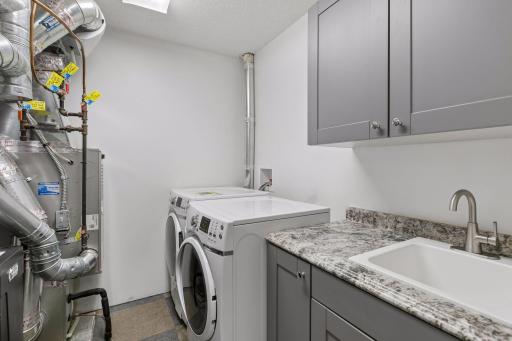 Laundry room complete with storage and sink!