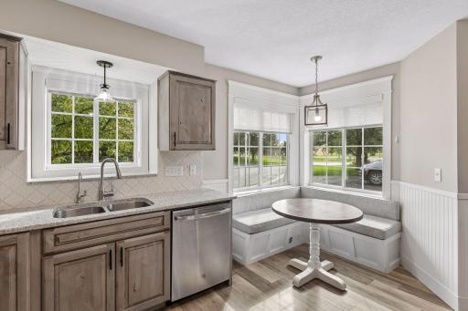 The kitchen breakfast nook is flooded with natural light!
