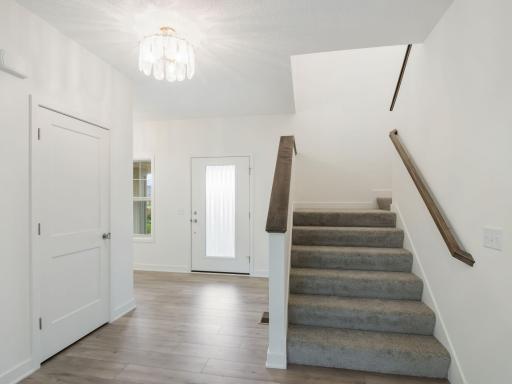 Open foyer with space to the other side of the door for adding a bench or foyer table