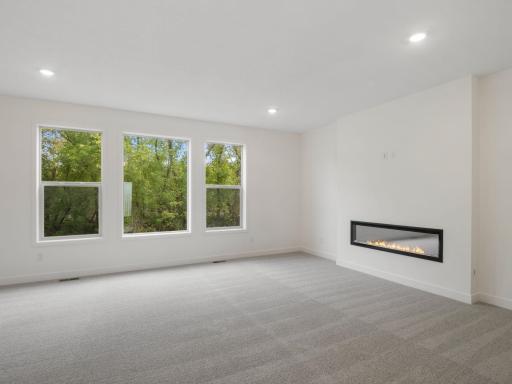 Oversized windows in the family room flooding in natural light