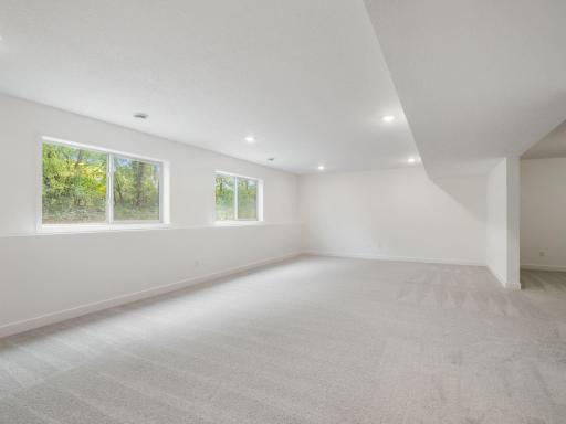 Lower level rec room with look-out windows