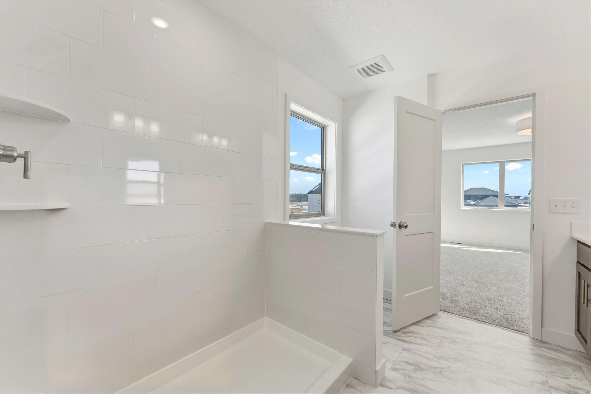 Owner's bath shower. Glass door is coming