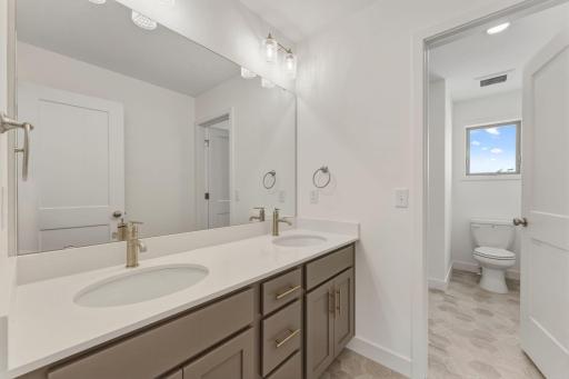 Upper level hall bath. tub and toilet are separated from vanities