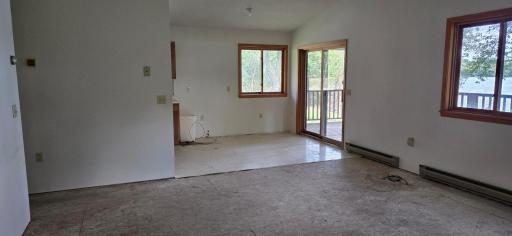 Inside entryway, Dining Area sliding door opens to Deck facing Lake