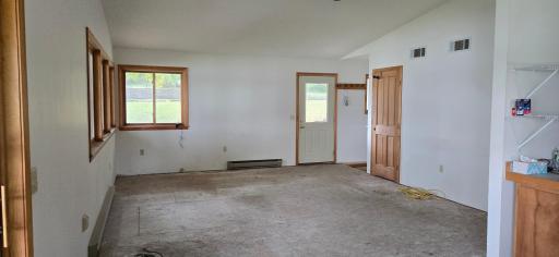 Living Rom with Front Closet and Stairway to Lower Level