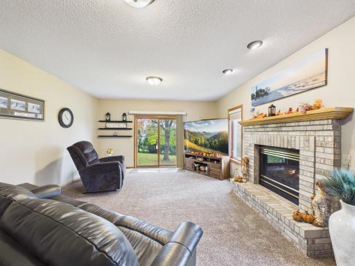Lower-level family room with fireplace and walkout access to the backyar