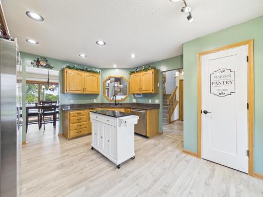 Kitchen view showing countertop workspace, cabinetry, and connection to the dining area.
