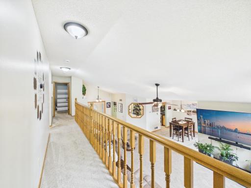 Upper-level landing overlooking the main living area.