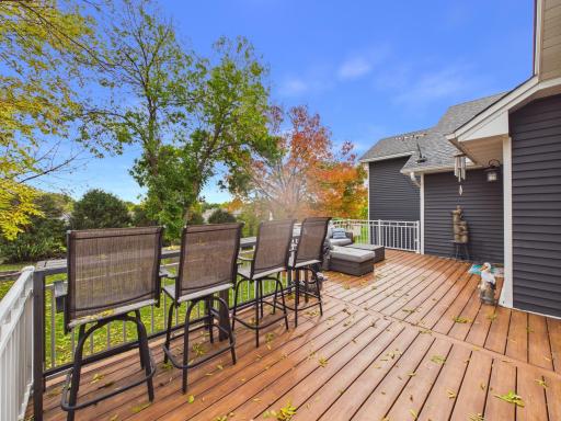 Composite deck extending from the home toward the backyard.