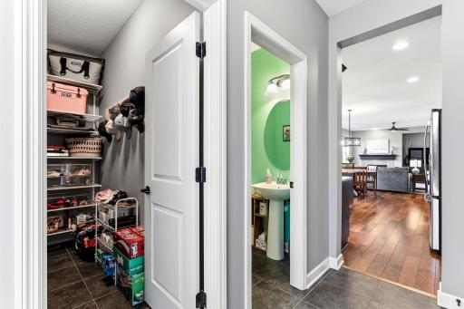 The main level includes a convenient half bathroom and a walk-in closet positioned directly off the mudroom entry.