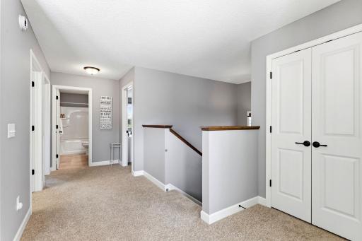 Top of the stairs, looking towards the full bathroom