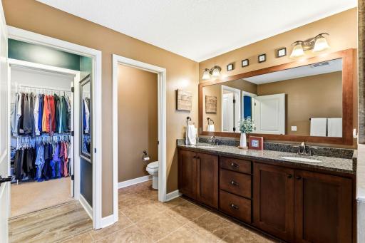 Designed for optimal privacy and flow, this well-appointed bathroom includes a separate water closet and provides direct access to the wardrobe.