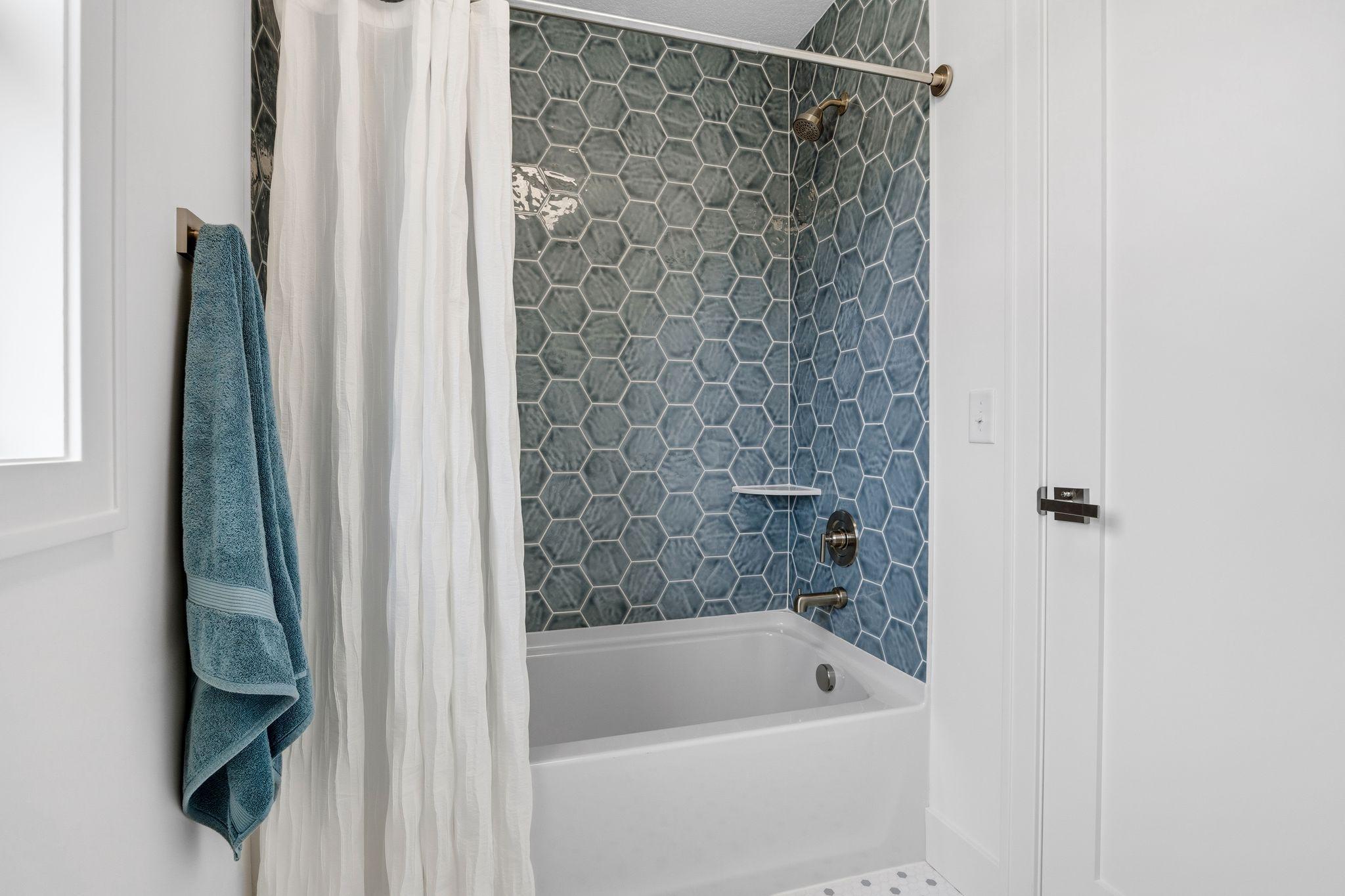 Lovely tiled shared full bath