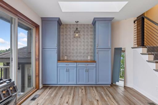 Newly added cabinets make great storage and an amazing coffee bar