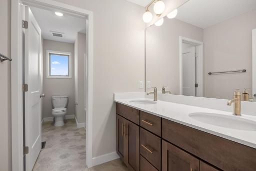 Full upper level bathroom with double sinks and....