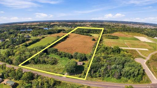 The land features rolling terrain, mature trees, and scenic water views that create an ideal setting for a signature estate or thoughtfully planned neighborhood
