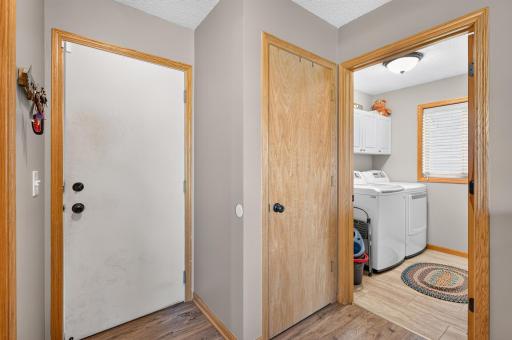 Main level laundry room and service door to garage.