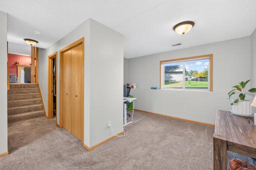 Spacious lower-level flex area offers plenty of room for a home office, play area, or additional living space.