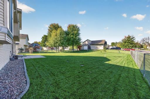 Spacious fully fenced backyard with a beautifully maintained lawn and plenty of room to relax, play, or entertain.