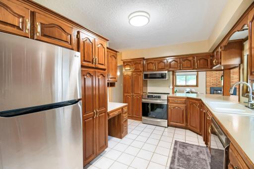 View of kitchen looking towards the family room--note the beautifully refinished cherry cabinets & nice appliances