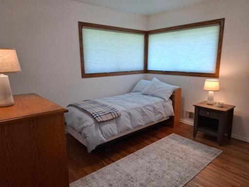 Bedroom #4 of 4 on the main floor--note the beautifully finished hardwood floors and new windows
