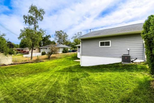 View of the garage side of the large fully fenced yard