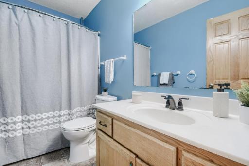 Full second-floor bathroom featuring a spacious vanity with ample counter space and a tub/shower combination. Conveniently located near the upper-level bedrooms.