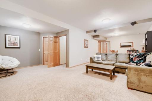 Fully finished lower-level recreation room offers plenty of space for relaxing, entertaining, or additional activities. The spacious layout provides flexibility for a TV area, game room, or gathering space.
