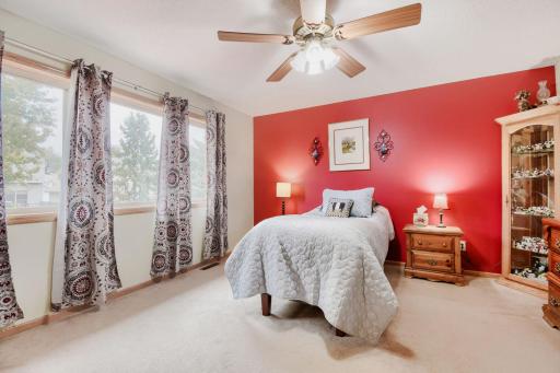 Spacious primary bedroom featuring abundant natural light and a private ensuite bathroom. A comfortable retreat with plenty of room to relax and unwind.