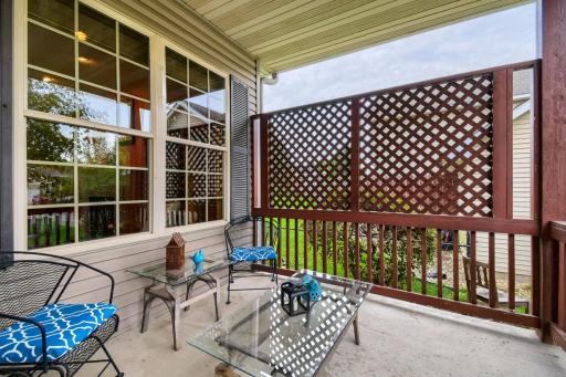 Covered outdoor patio provides a private and comfortable space to relax and enjoy the fresh air. Decorative lattice adds privacy while maintaining an open, inviting feel.