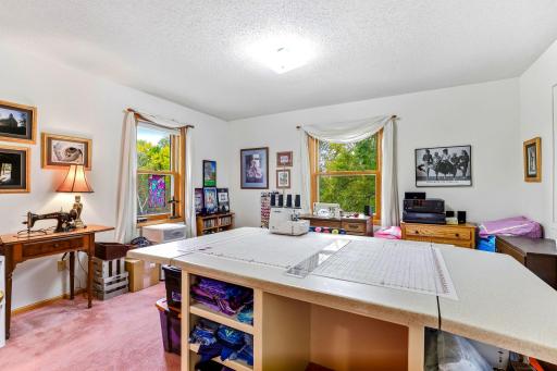 Setup as Sewing Room with Bright Windows to the Front Yard