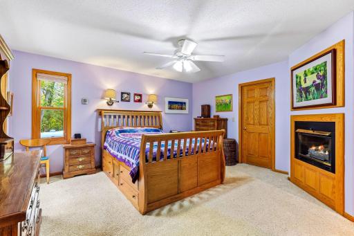 Primary Bedroom with Walk-In Closet and Fireplace