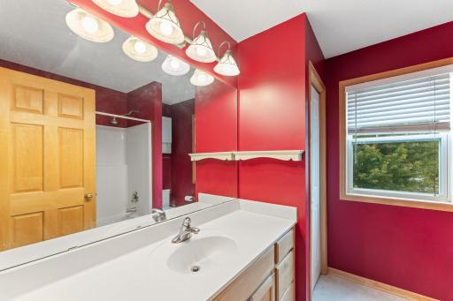 Main bath on upper level with ample counter/storage space.