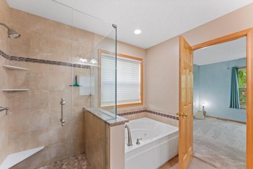 Freestanding shower and jetted tub.