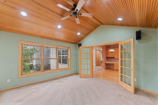 French doors make it easy to close off the sunroom if you want make this your home office.