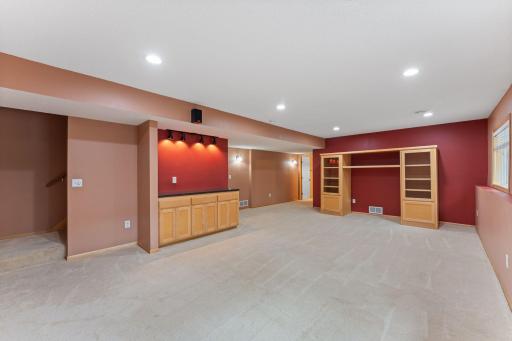 Lower level rec room. Stand alone entertainment center and SAFE (in closet) will remain with home.