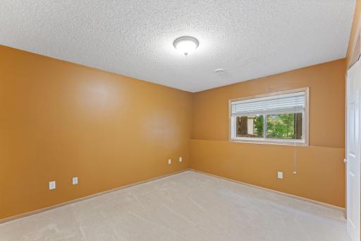 Lower level bedroom offers privacy for guests.