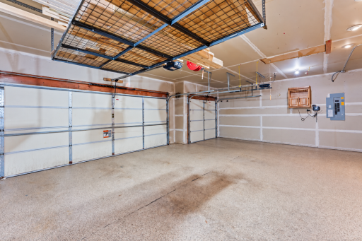 Massive gargage with a DOUBLE DEEP stall offering four parking spaces (or the perfect spot for a workshop or man cave. B-hyve remote sprinkler control system easily accessible.