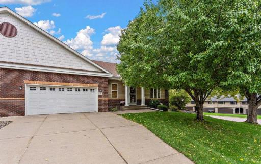 Welcome to 397 Whispering Lane! A great walk-out end unit!