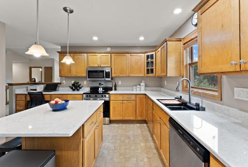 Maple cabinets with pull out shelving and the coolest new sink and faucet ever!
