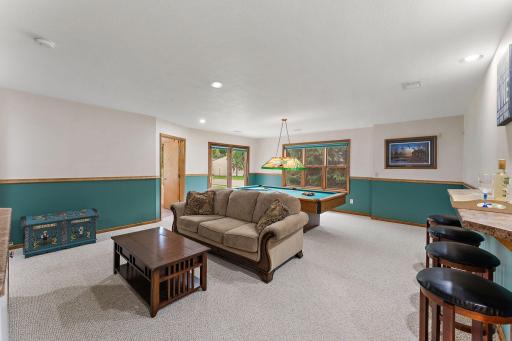 Family room is large and versatile - pool table could stay~