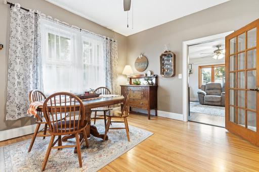 Formal dining room in between the kitchen and living room with a large window to let natural light brighten this space