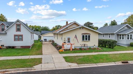 Concrete driveway extends all the way behind the home to the detached garage