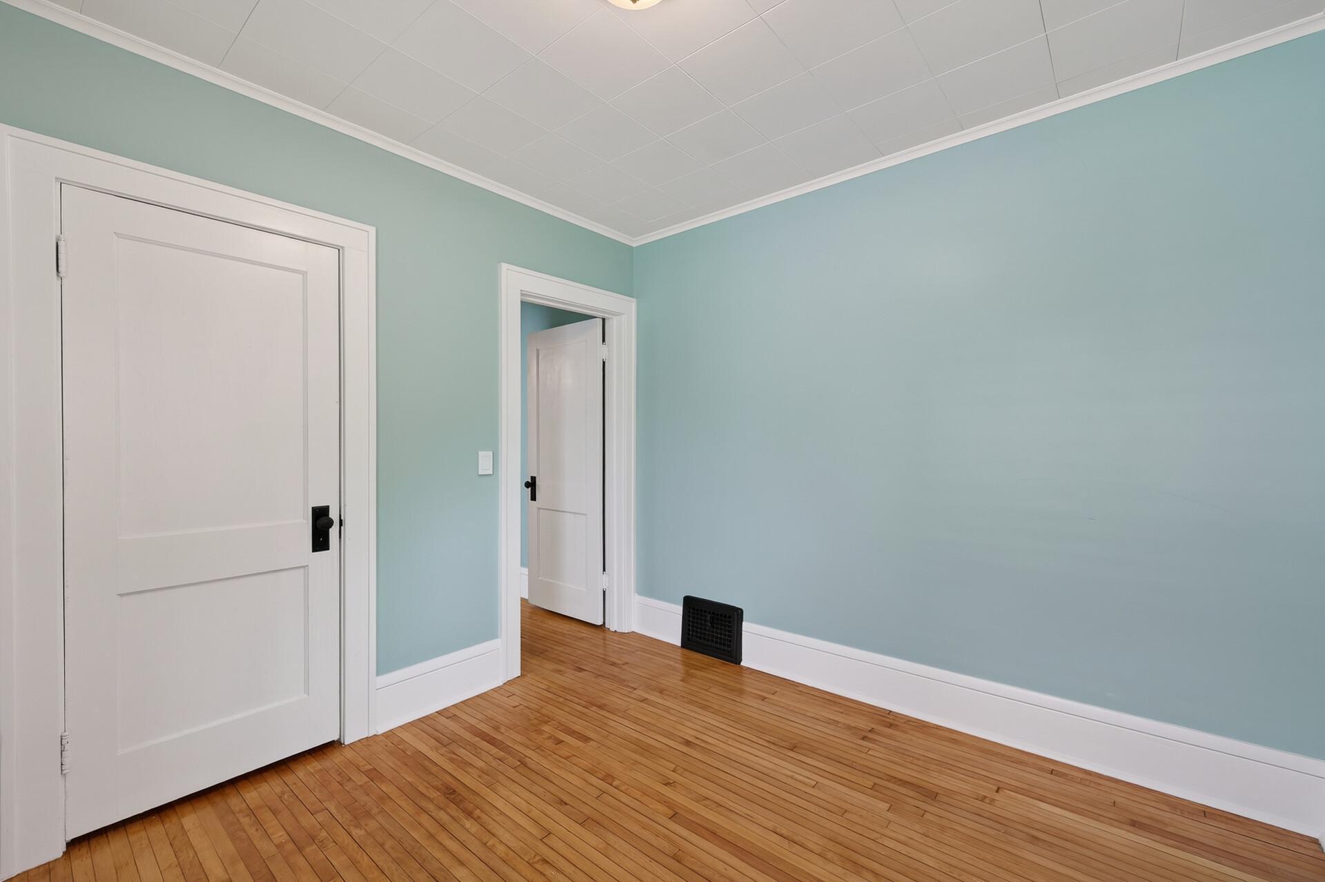 Main level bedroom with fresh paint