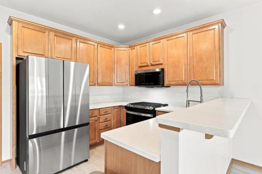 Well-designed kitchen with abundant cabinetry and newer stainless steel appliances.