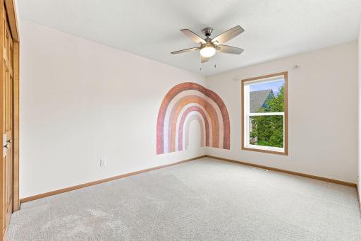 Comfortable upper-level bedroom with easy access to the full bath.