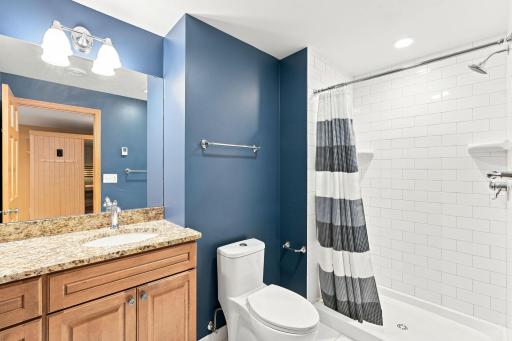 Convenient lower-level 3/4 bath with walk-in shower.
