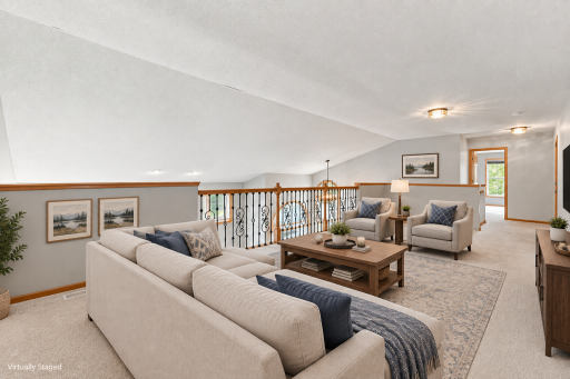 Flexible loft space overlooking the living room, ideal for a home office or additional living area.