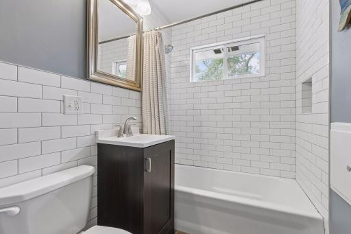 New subway tile shower, backsplash, vanity, floor, paint light, fixtures!